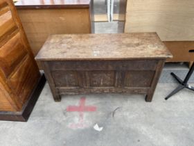 AN OAK GEORGE III STYLE BLANKET CHEST WITH CARVED THREE PANEL FRONT, 36" WIDE