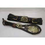 TWO HORSE BRASSES ON LEATHER STRAPS