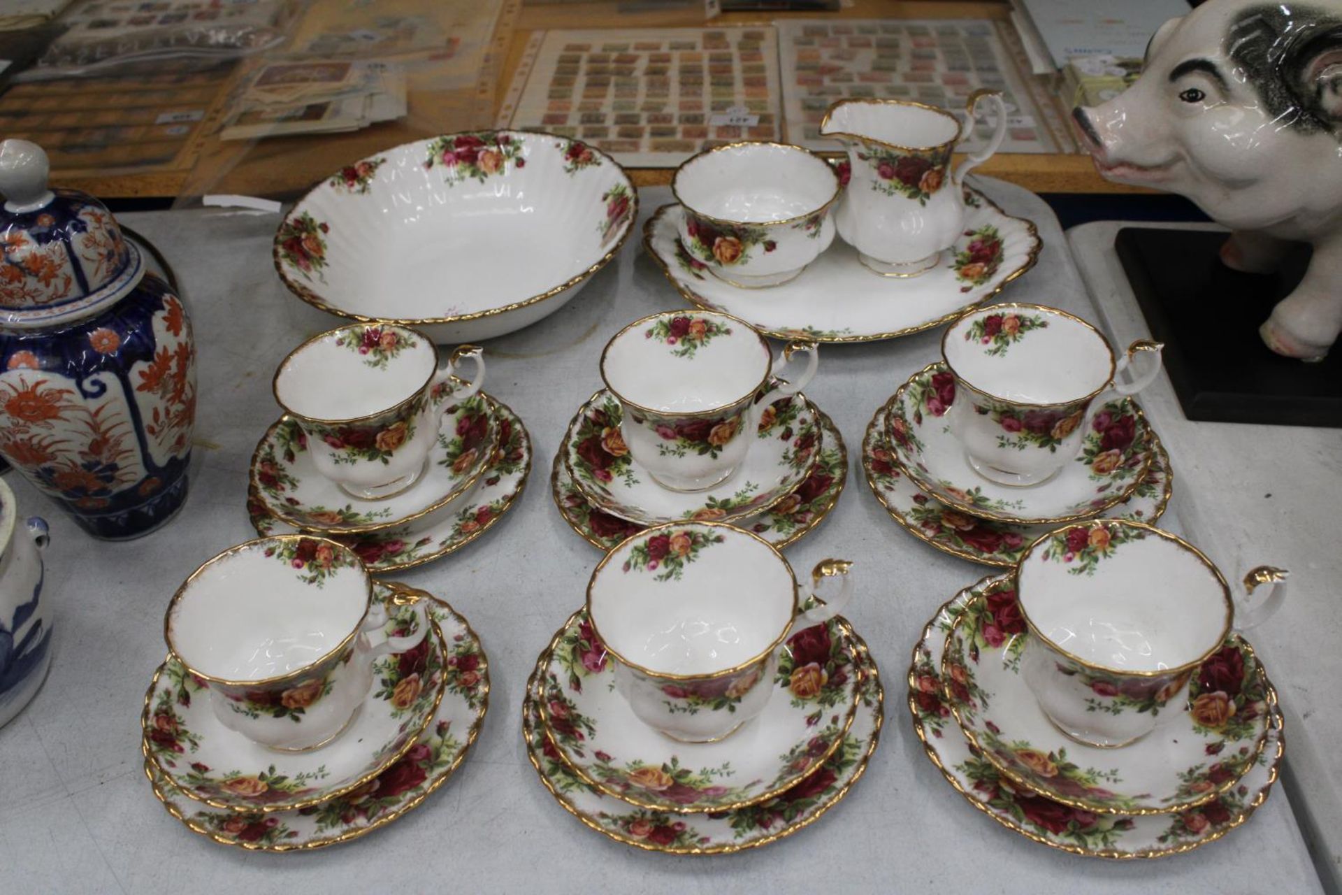 TWENTY TWO PIECES OF ROYAL ALBERT OLD COUNTRY ROSES TO INCLUDE TRIOS, CAKE PLATE, SUGAR, MILK AND