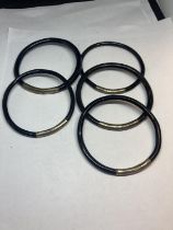 FIVE BANGLES POSSIBLY SILVER AND EBONY