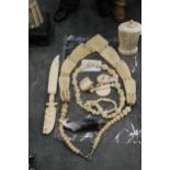 A COLLETION OF CARVED BONE ITEMS TO INCLUDE A SCENT BOTTLE, NECKLACES, ETC