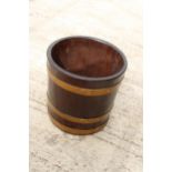 A VINTAGE WOODEN AND METAL BANDED PALE BUCKET
