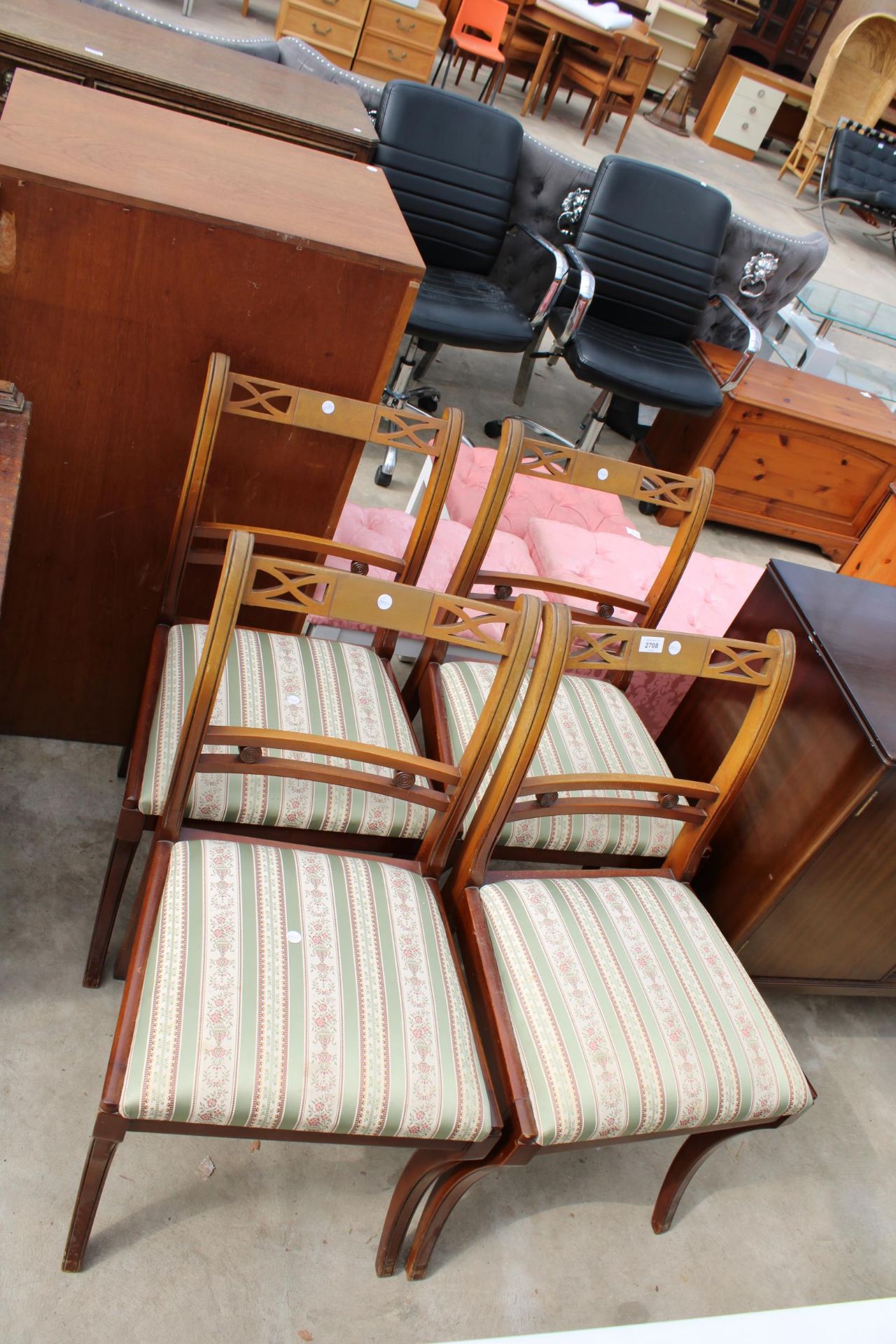 A SET OF FOUR REGENCY STYLE DINING CHAIRS