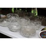A QUANTITY OF GLASS FOOTED CAKE STANDS AND BOWLS