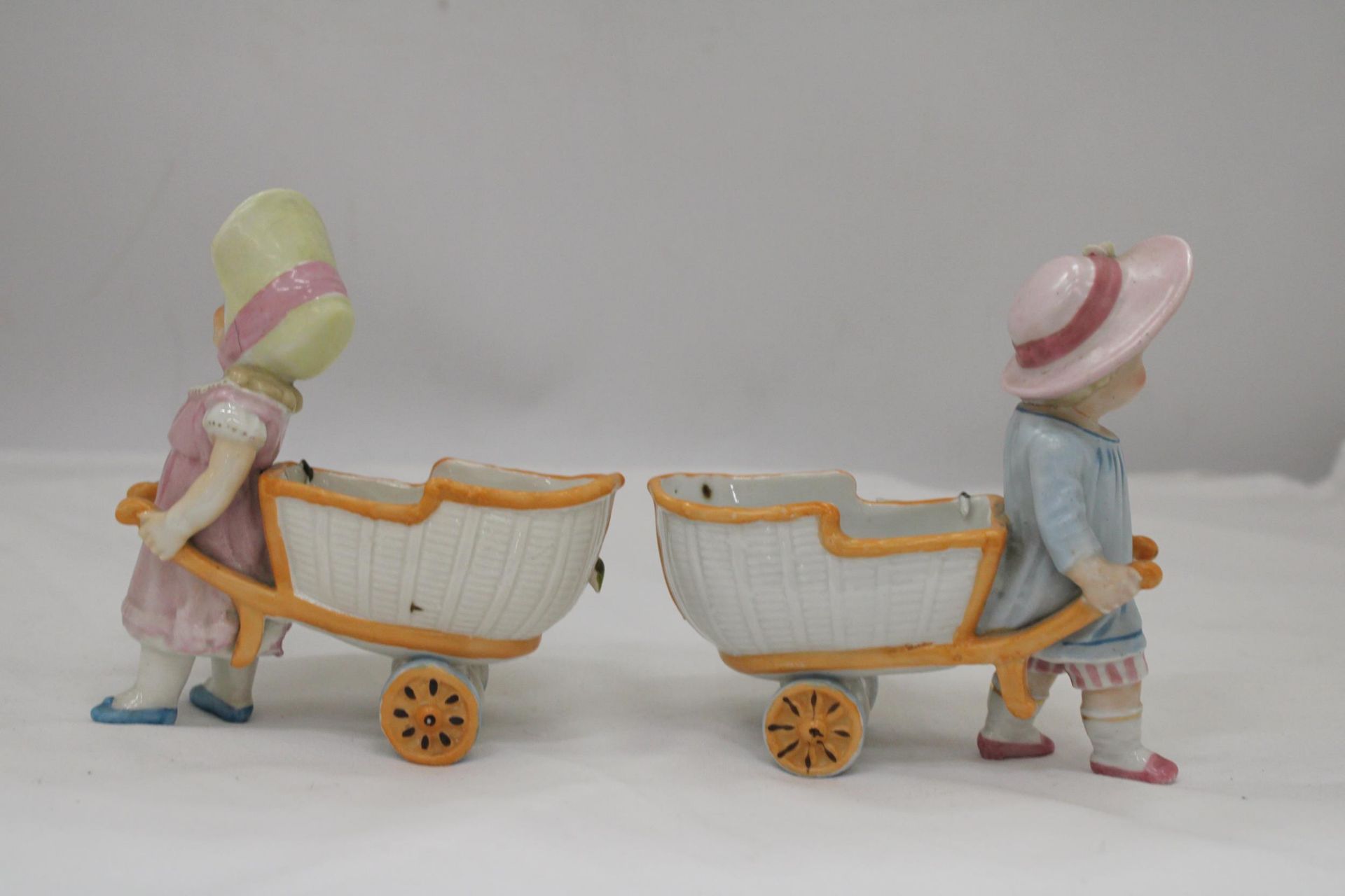 TWO VINTAGE CONTA AND BOHME GERMAN FAIRINGS TO INCLUDE TWO GIRLS PULLING FLOWER CARTS, ONE WITH A - Image 5 of 5