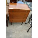 A RETRO TEAK CHEST OF FOUR DRAWERS ON TAPERING LEGS WITH BRASS HANDLES 25" WIDE