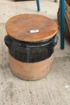 A LIDDED TERRACOTTA STORAGE POT