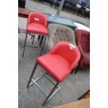 A PAIR OF HIGH BACK BAR STOOLS, STAINLESS STEEL FRAME WITH BRIGHT RED SEATS