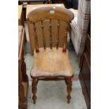 A VICTORIAN ELM AND BEECH KITCHEN CHAIR WITH TURNED UPRIGHT LEGS AND STRETCHERS