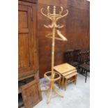 A BENTWOOD COAT/STICK STAND AND FIVE WOODEN HANGERS