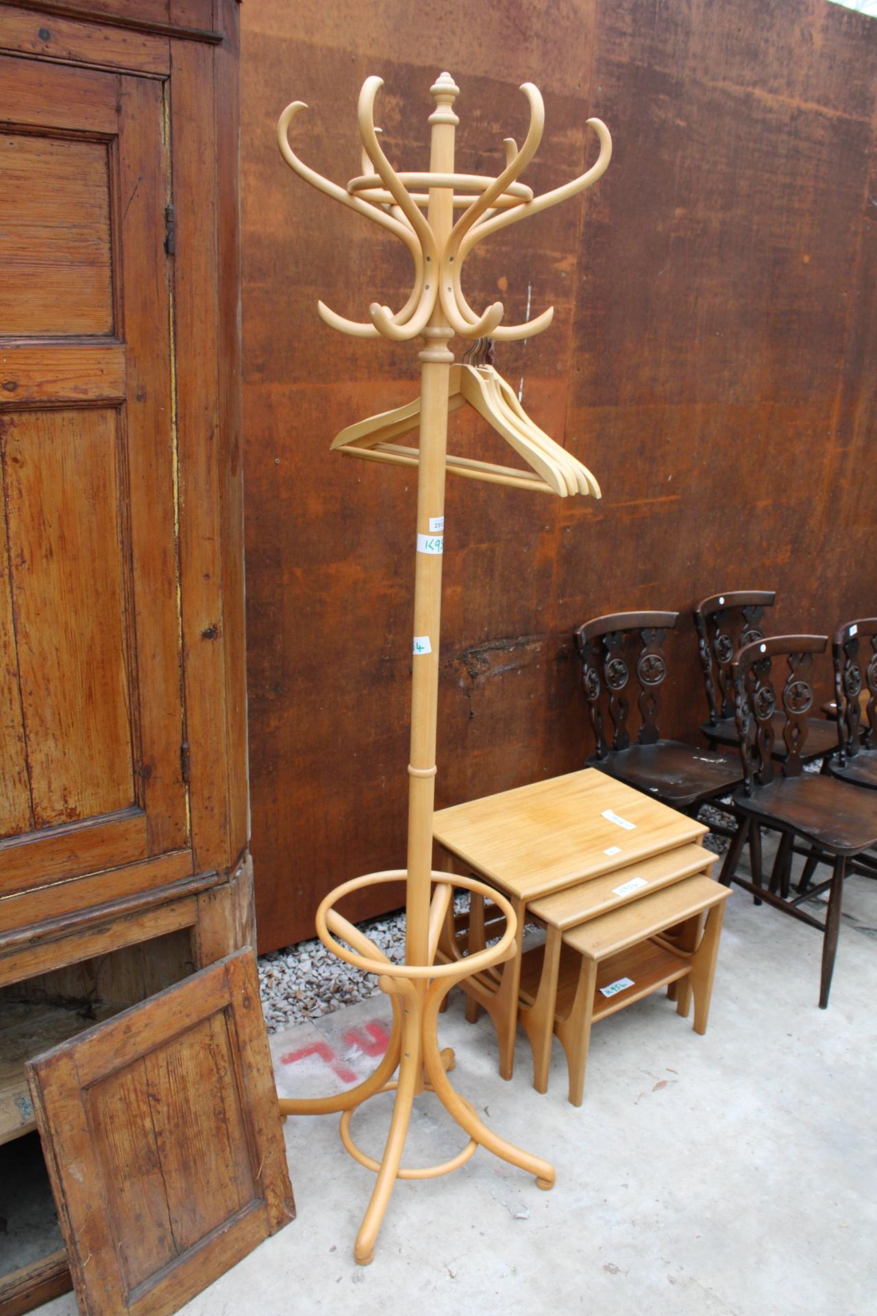 A BENTWOOD COAT/STICK STAND AND FIVE WOODEN HANGERS