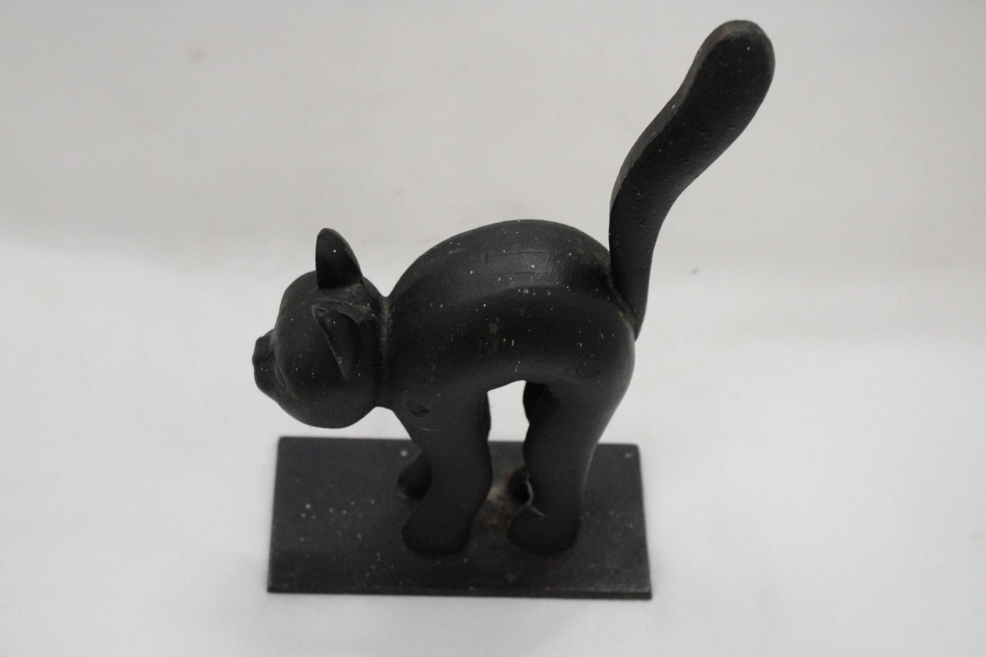 A HEAVY CAST IRON BLACK CAT DOORSTOP