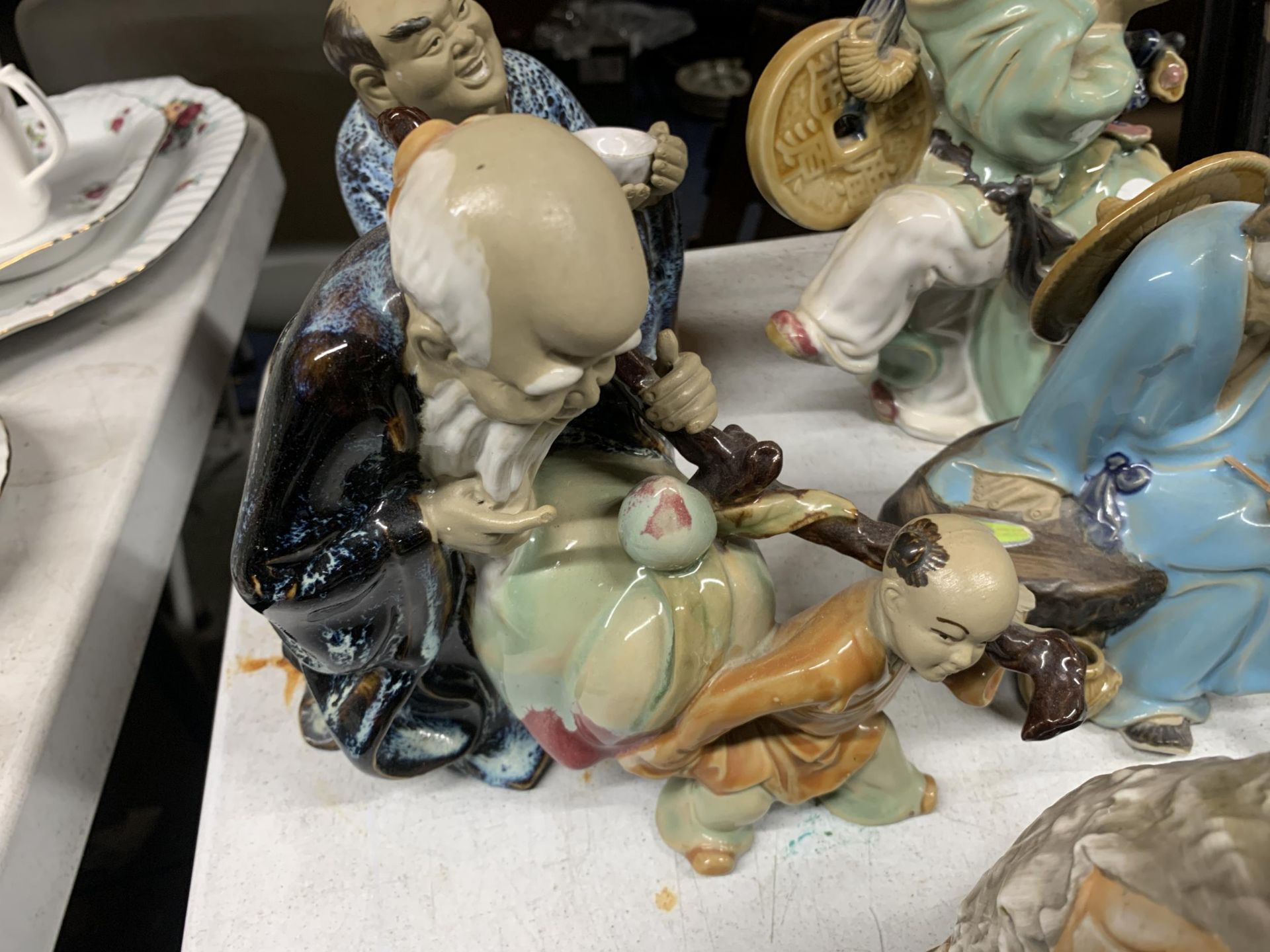 A COLLECTION OF SEVEN ORIENTAL 'MUD MEN', A CAPODIMONTE STYLE FIGURE, ETC - Image 2 of 5
