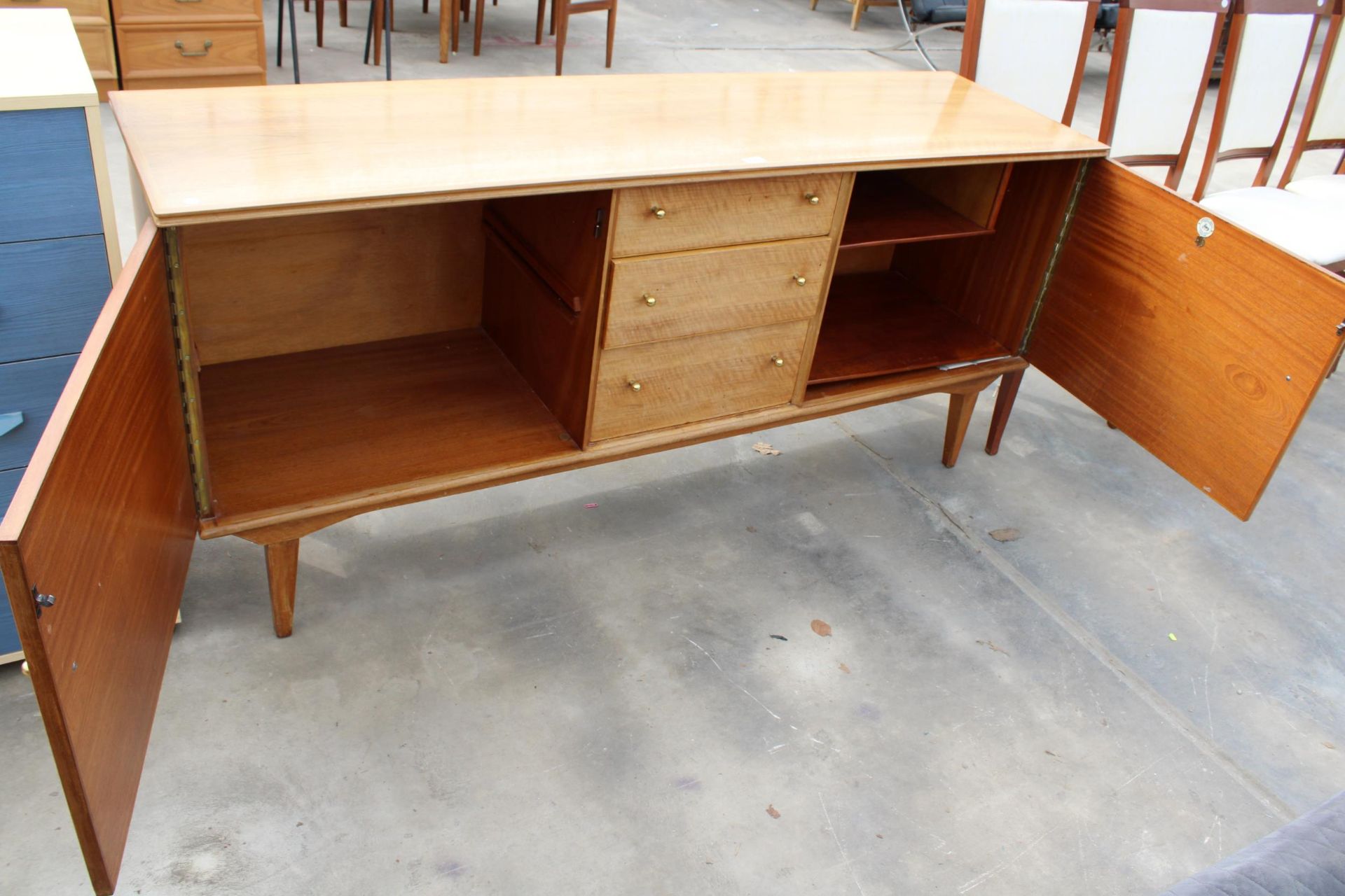 A RETRO HANDCRAFT ALFRED COX WALNUT SIDEBOARD ENCLOSING THREE DRAWERS AND TWO CUPBOARDS, 67" WIDE - Image 6 of 6
