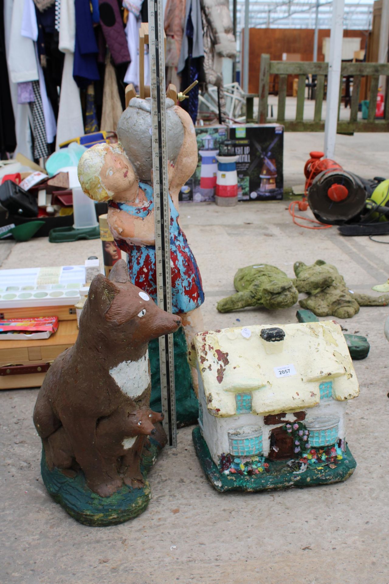 THREE CONCRETE GARDEN FIGURES TO INCLUDE A FOX AND A HOUSE ETC