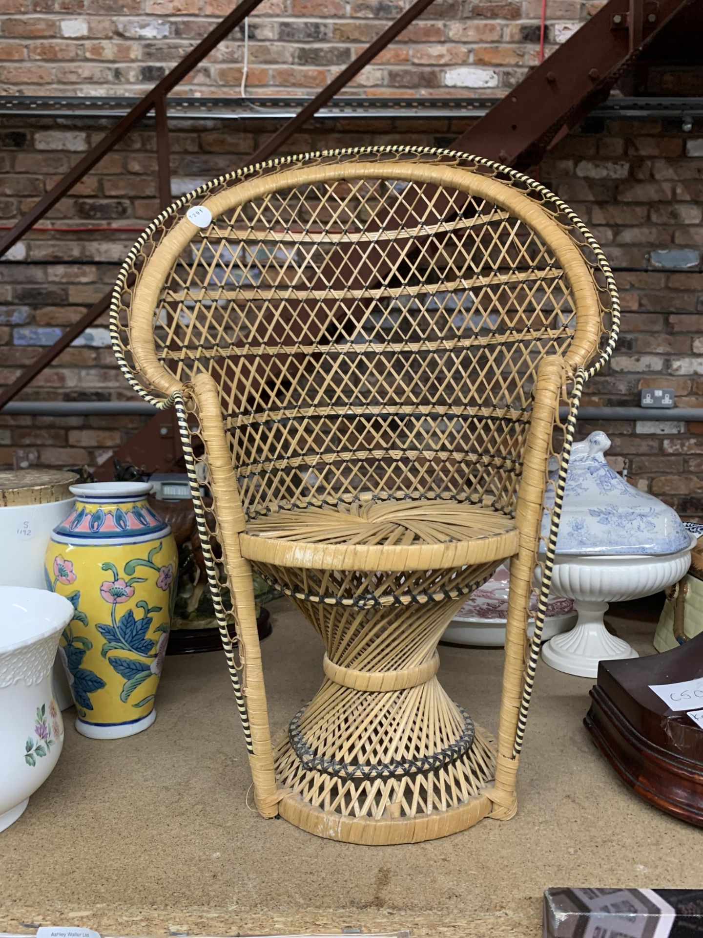 A MINIATURE WICKER 'PEACOCK' CHAIR