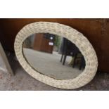 A MODERN OVAL WICKER FRAMED WALL MIRROR, 34" X 27"