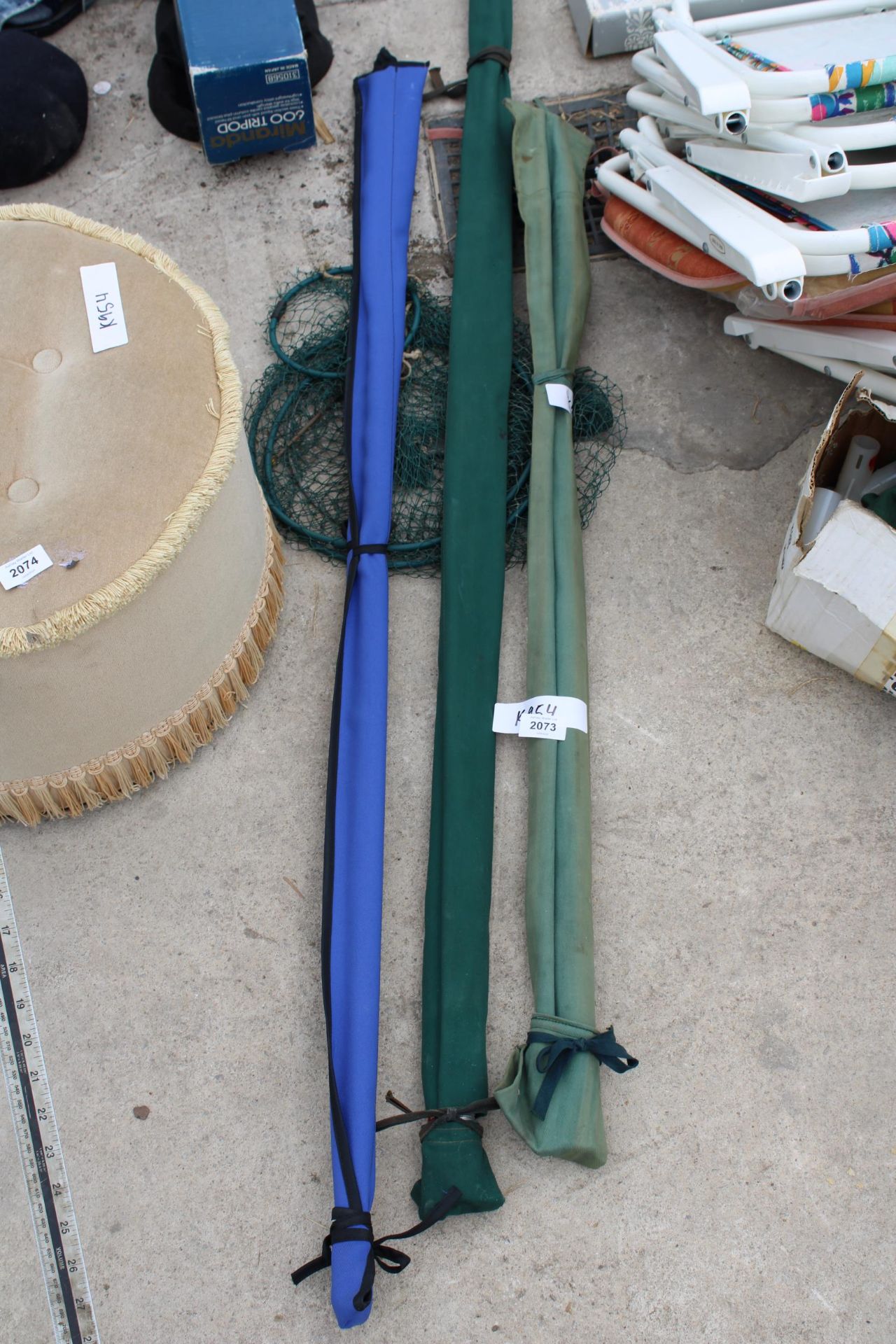 AN ASSORTMENT OF FISHING RODS AND NETS