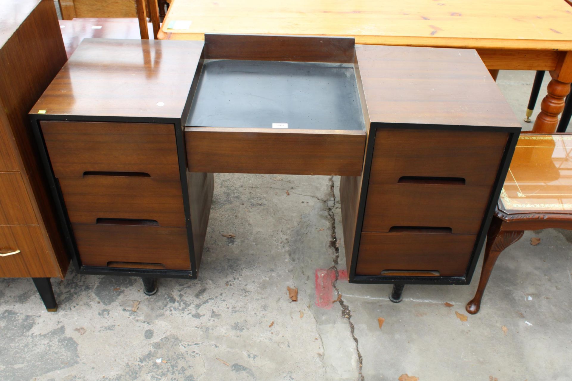 A RETRO STAG TWIN PEDESTAL DESK/DRESSING TABLE ENCLOSING SEVEN DRAWERS 48" WIDE