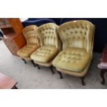 THREE MODERN BUTTONED LOUNGE CHAIRS ON CABRIOLE LEGS