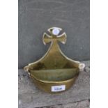 A VINTAGE BRASS WALL MOUNTED HOLY WATER CARRIER