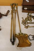 A LARGE BRASS COMPANION SET