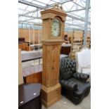 A MODERN PINE LONGCASE CLOCK WITH ARCHED PAINTED DIAL AND BATTERY POWERED MOVEMENT