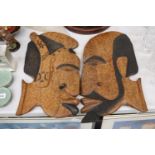 A PAIR OF LARGE CARVED WOODEN HEADS, IN THE STYLE OF PICASSO, 48CM X 26CM