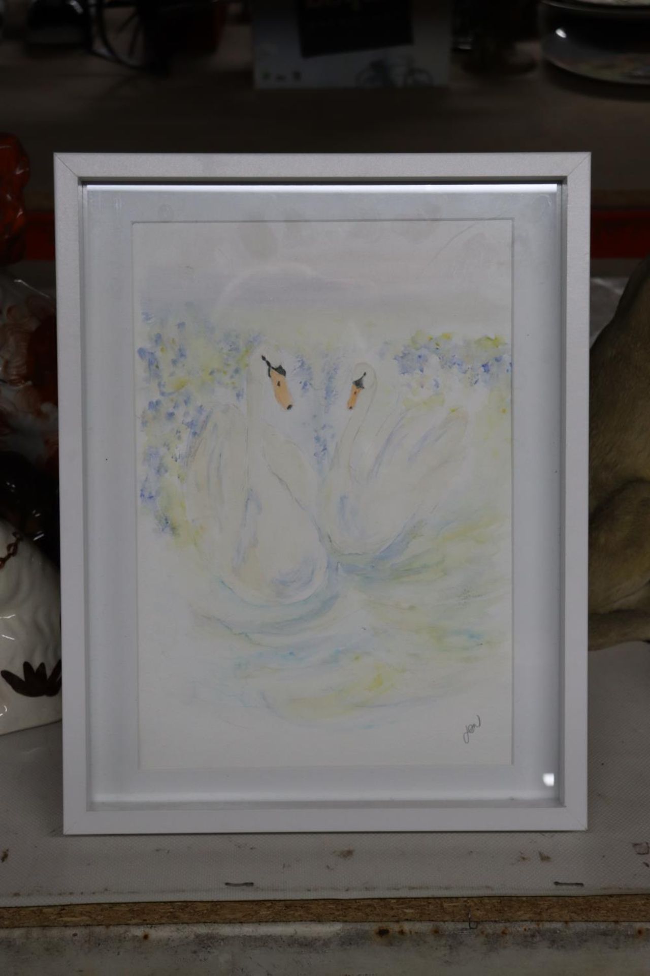 A SIGNED WATERCOLOUR OF TWO SWANS BY JEN