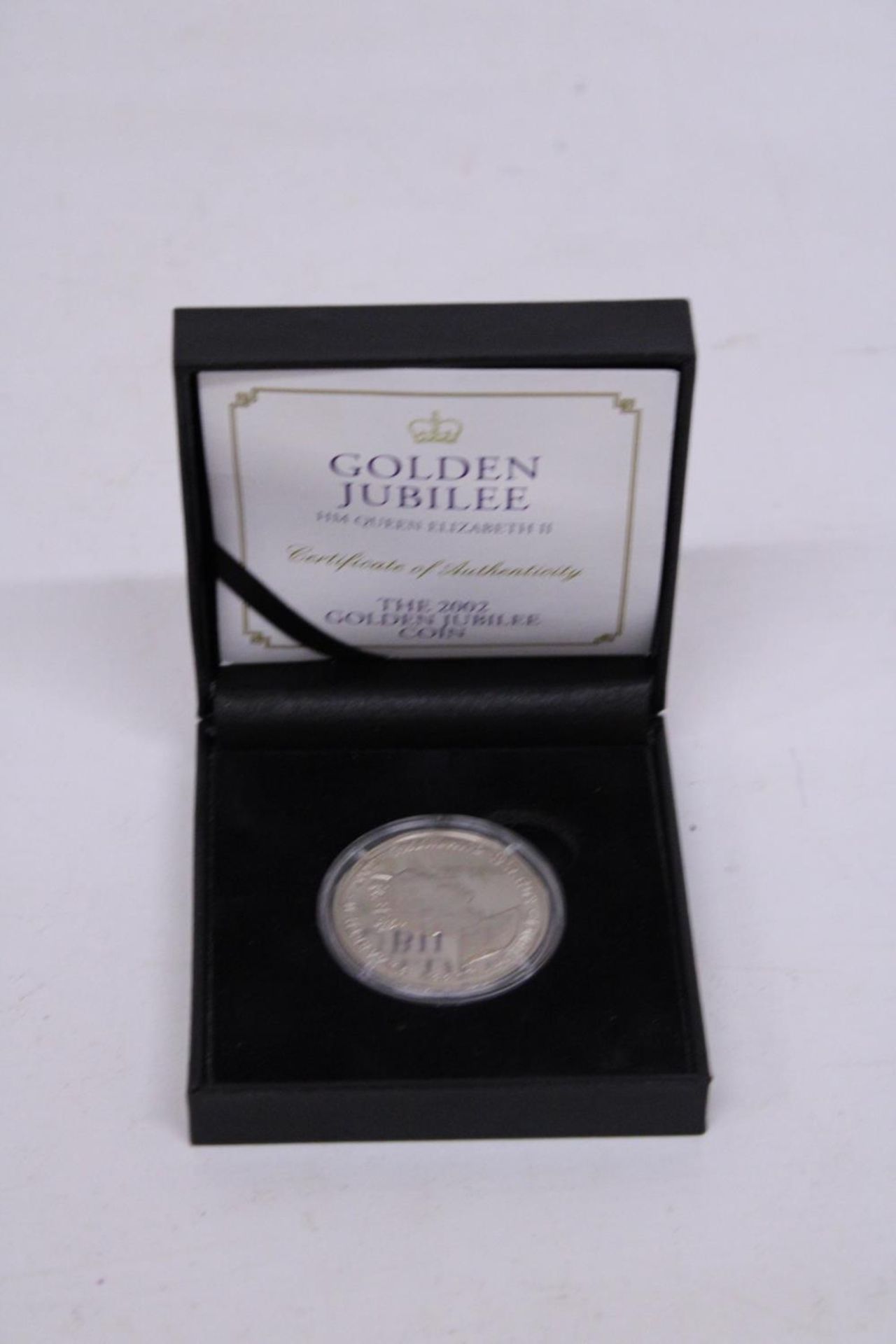 A GOLDEN JUBILEE HM QUEEN ELIZABETH 2002 50P COIN IN PRESENTATION BOX WITH CERTIFICATE OF