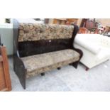 A MODERN WINGED SETTEE WITH UPHOLSTERED SEAT AND BACK 62" WIDE