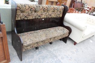 A MODERN WINGED SETTEE WITH UPHOLSTERED SEAT AND BACK 62" WIDE