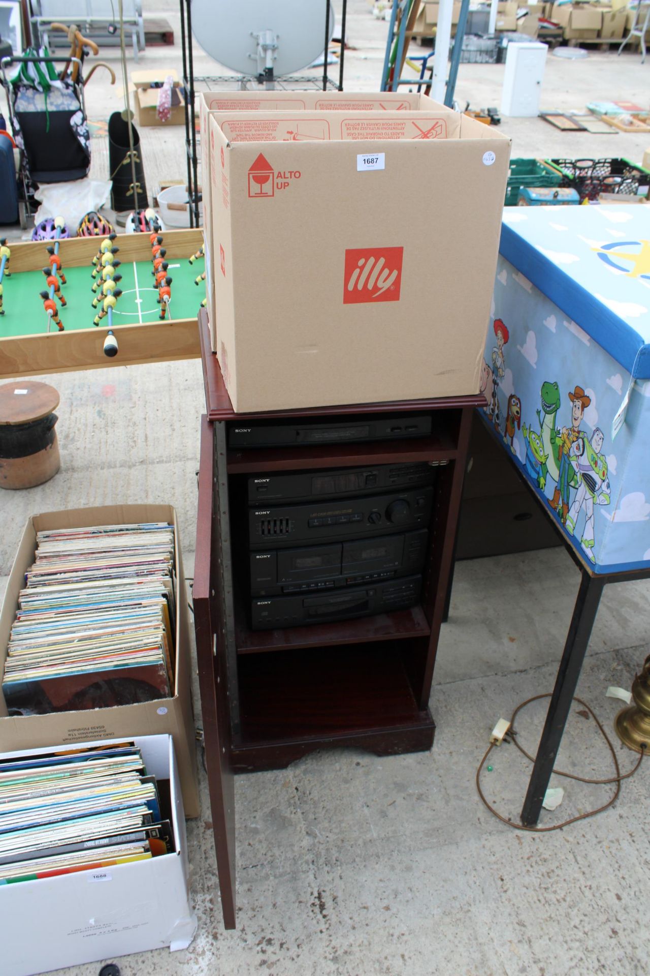 A CABINET WITH A SONY STEREO SYSTEM AND AN ASSORTMENT OF LP RECORDS