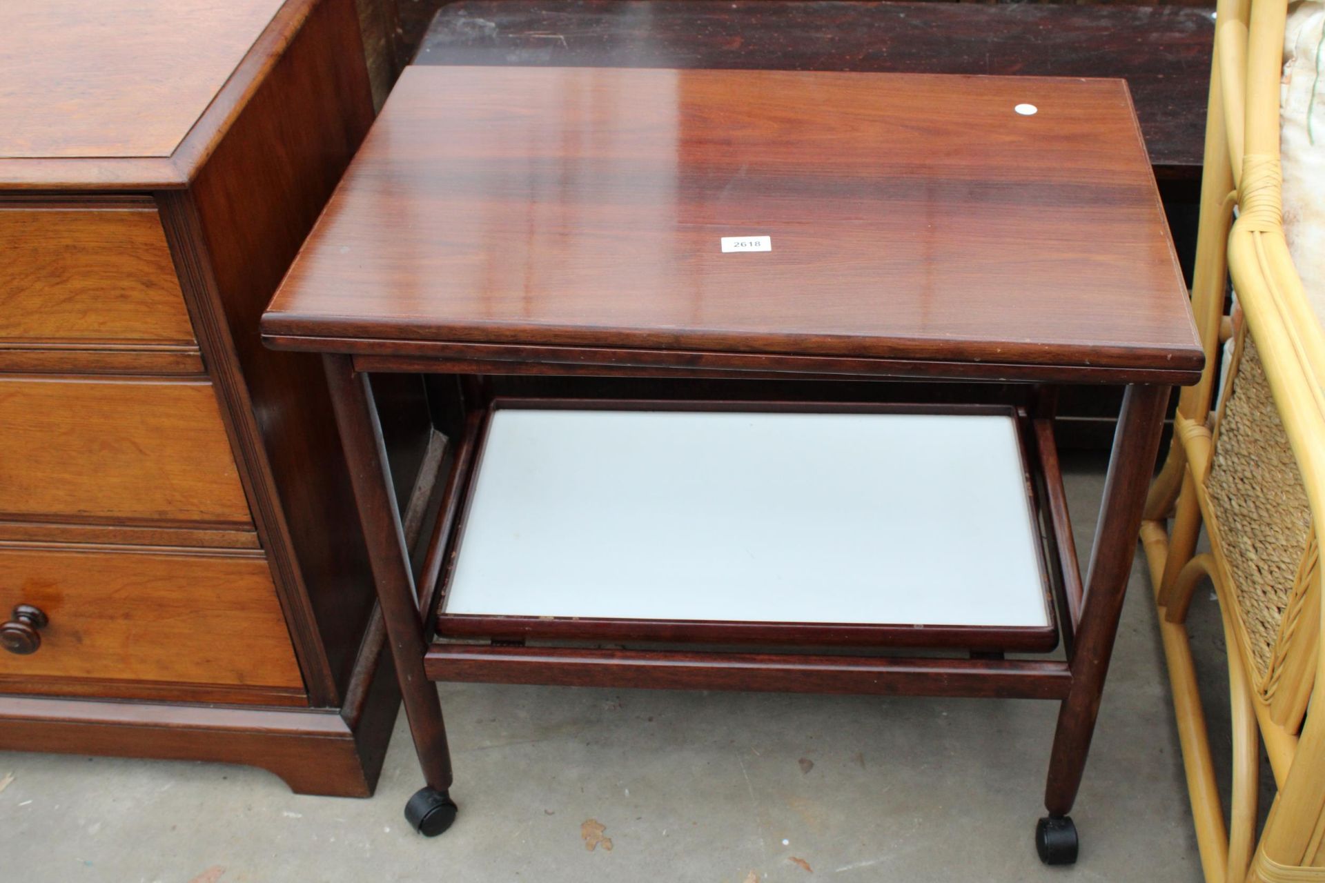 A MODERN MAHOGANY TWO TIER FOLD-OVER TROLLEY WITH DETACHABLE TRAY