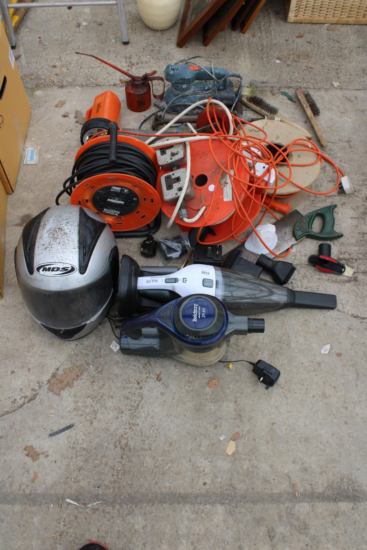 AN ASSORTMENT OF ITEMS TO INCLUDE EXTENSION LEADS, A MOTORBIKE HELMET AND AN ELECTRIC SANDER ETC