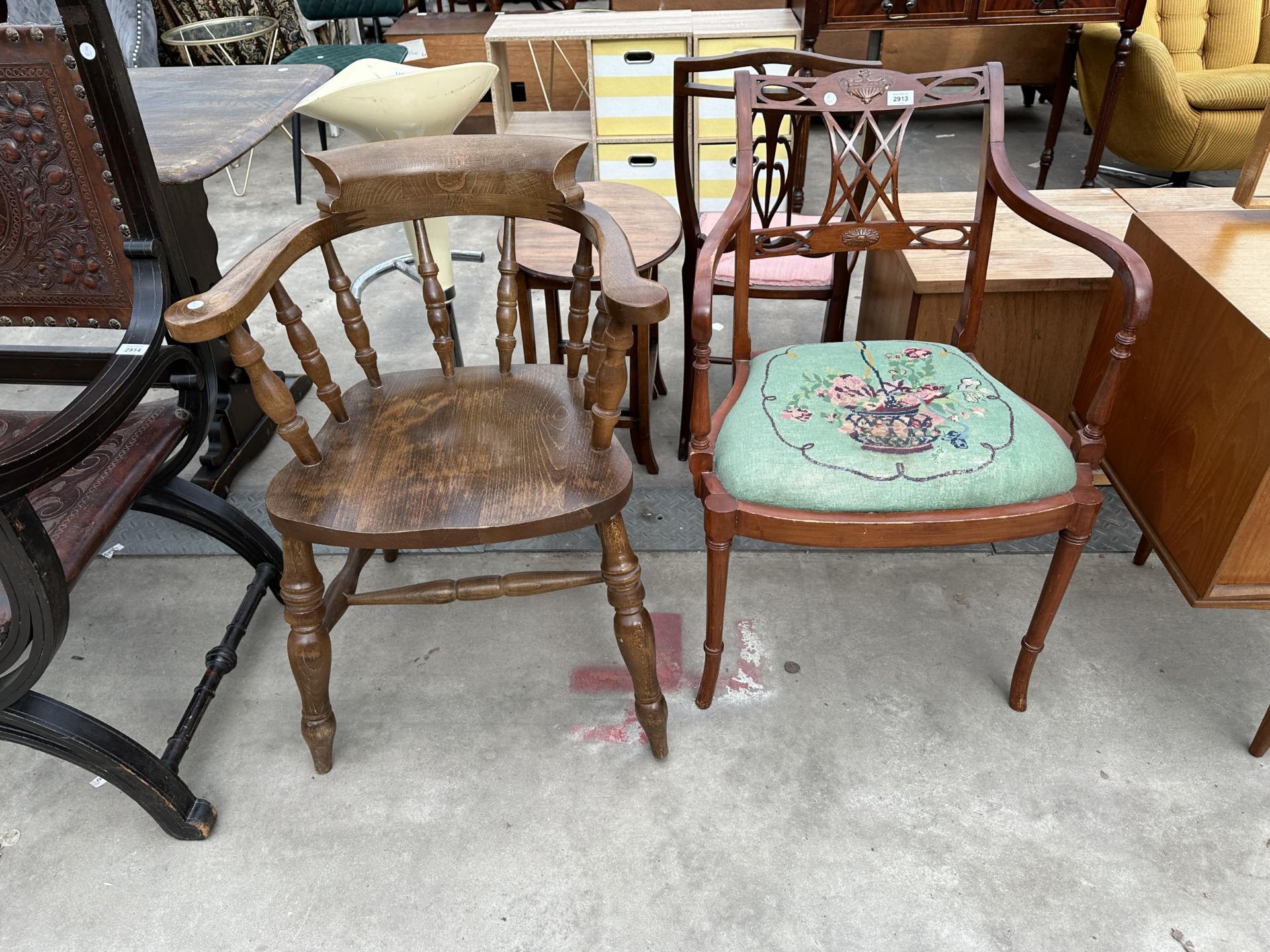 A VICTORIAN STYLE BEECH FRAMED CAPTAINS CHAIR AND SHERATON STYLE CARVED CHAIRS WITH WOOLWORK SEAT