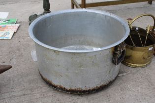 A LARGE STAINLESS STEEL COOKING POT