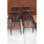 A SET OF FOUR ERCOL STYLE PLUME OF FEATHERS DINING CHAIRS