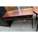 A STAG MINSTEL SIDE TABLE ENCLOSING THREE DRAWERS, 47" WIDE