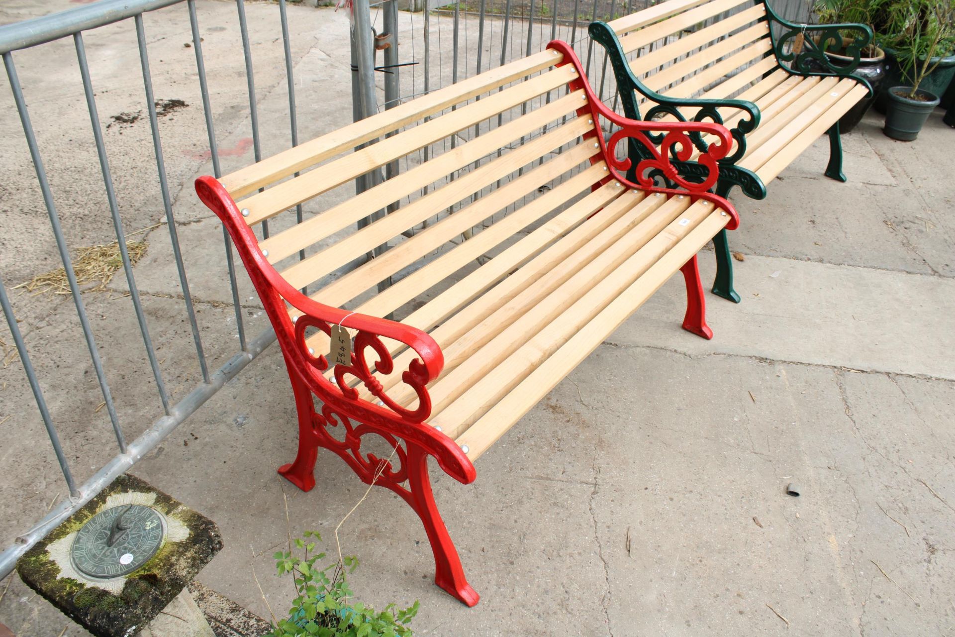 A WOODEN SLATTED GARDEN BENCH WITH DECORATIVE CAST ENDS - Image 2 of 2