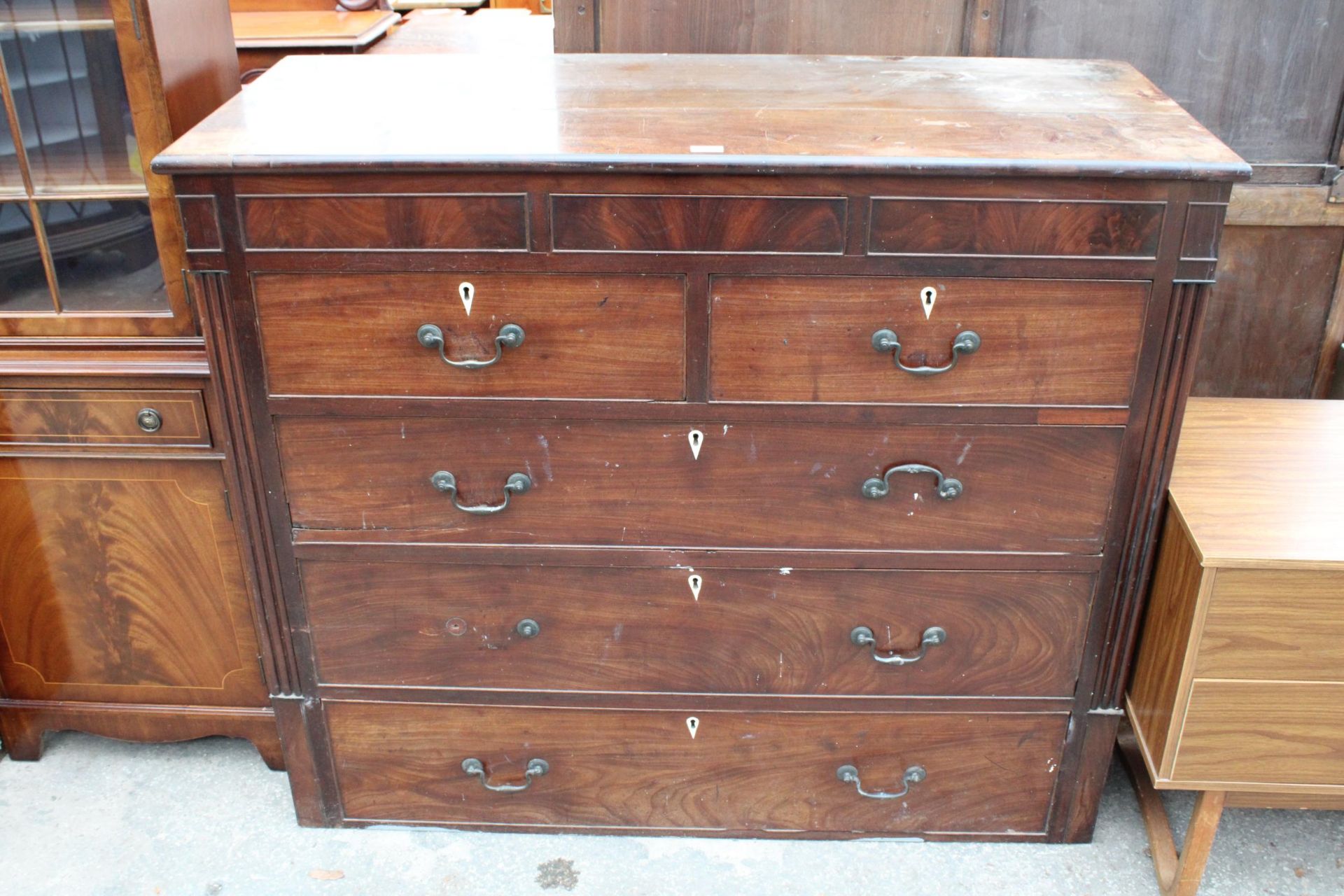 A 19TH CENTURY MAHOGANY CHEST OF TWO SHORT AND THREE LONG DRAWERS WITH SECRET FRIEZE DRAWER 52" WIDE