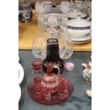A QUANTITY OF GLASSWARE TO INCLUDE CRANBERRY GLASS, DECANTERS