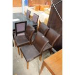 A SET OF FOUR MODERN FAUX LEATHER DINING CHAIRS