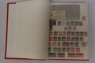 THE RED COMPASS STOCKBOOK HOUSING AN ECLECTIC COLLECTION OF GB AND BRITISH COMMONWEALTH MINT AND