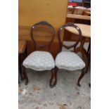 A PAIR OF VICTORIAN MAHOGANY BALLOON BACK DINING CHAIRS