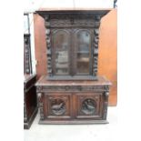 A VICTORIAN OAK BLACK FOREST STYLE SIDEBOARD WITH ASSOCIATED 2 DOOR GLAZED BOOKCASE, ALL HEAVILY
