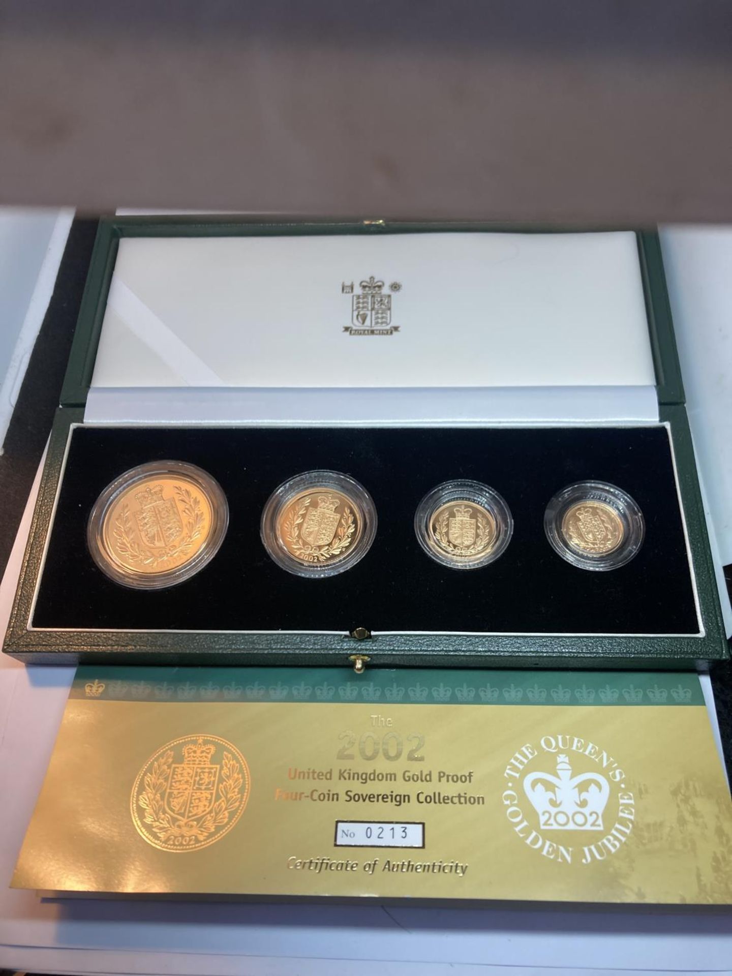 A 2002 ROYAL MINT GOLD PROOF FOUR COIN COLLECTION CELEBRATING QUEEN ELIZABETH II GOLDEN JUBILEE TO