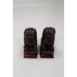 A PAIR OF HEAVY SOLID ORIENTAL FOO DOGS, HEIGHT 11CM