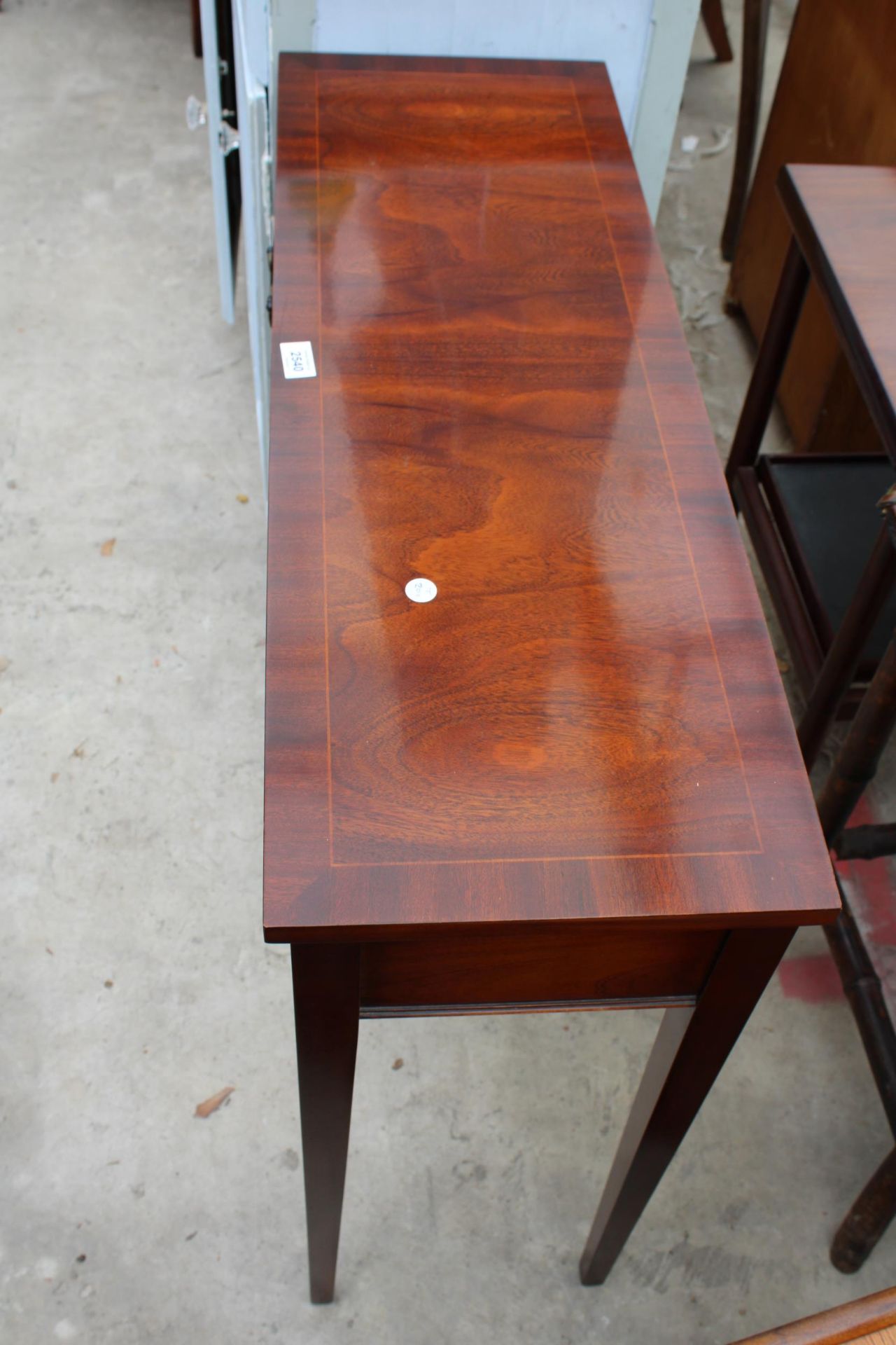 A MAHOGANY AND CROSSBANDED SIDE TABLE WITH TWO FRIEZE DRAWERS ON TAPERING LEGS 35" WIDE - Image 3 of 3