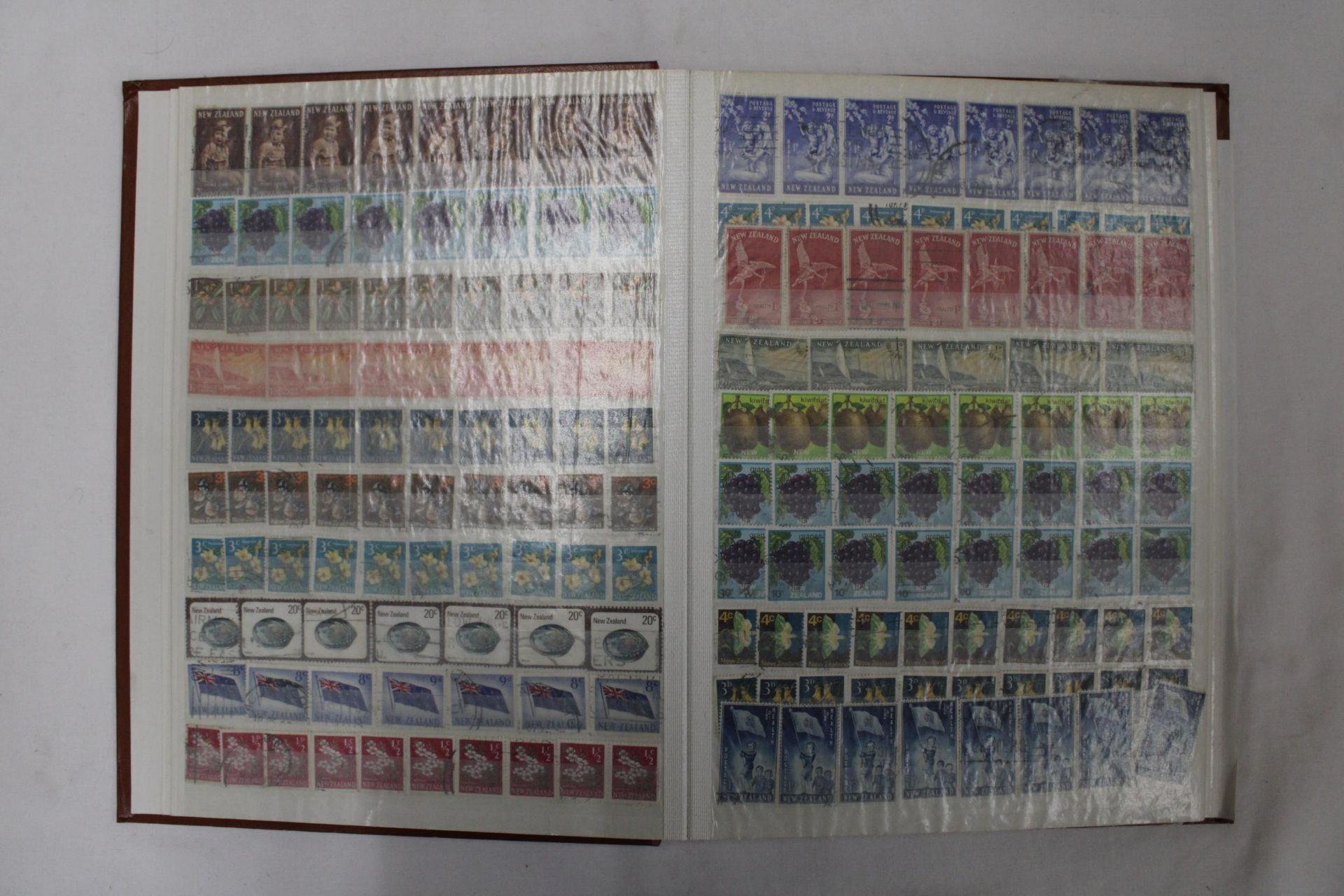 TWO FULL ALBUMS CONTAINING BRITISH AND FOREIGN STAMPS